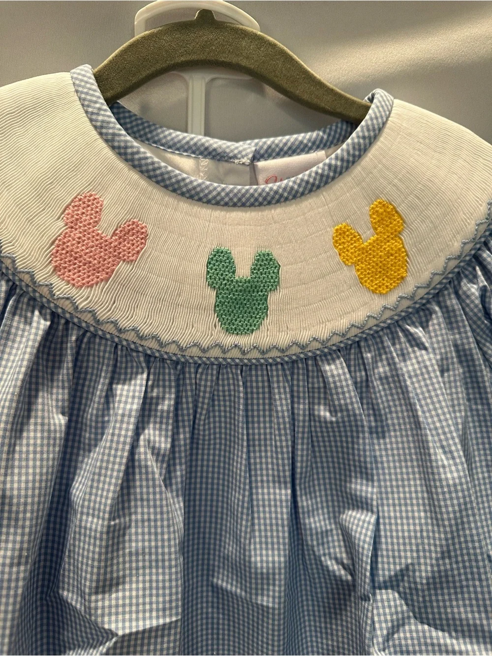 Blue Gingham Smocked Top with Pink Leggings with Matching Bow.
